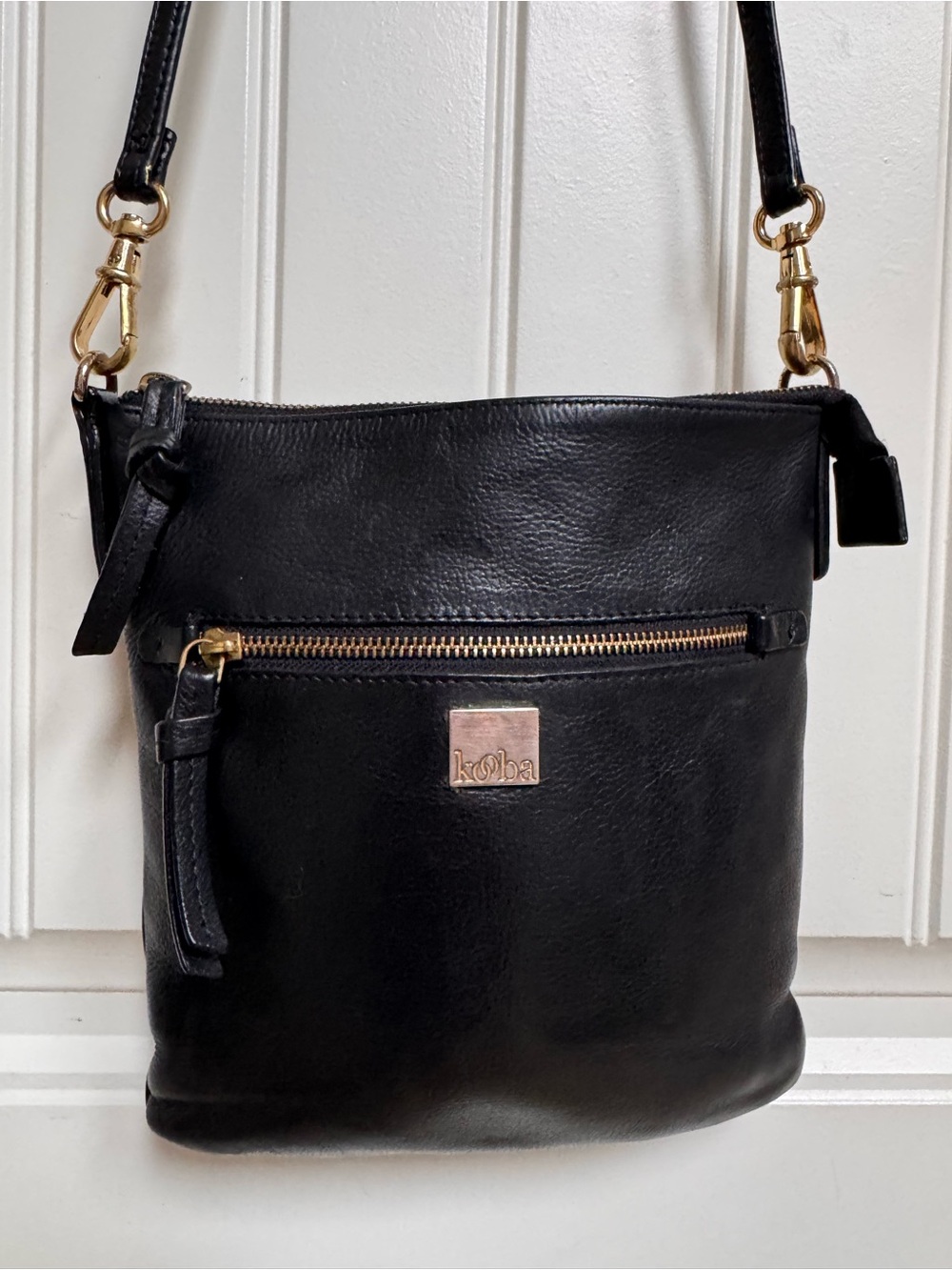 Kooba Black Leather Crossbody Bag. 9” by 9” by 0.5”